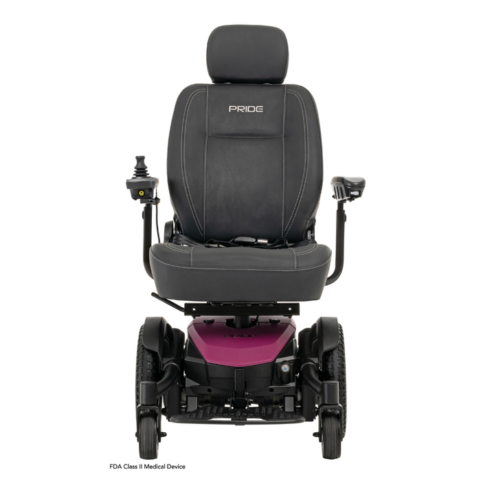 A black and pink Pride Mobility Jazzy® EVO 613 Powerchair with ATX Suspension, featuring padded seat, headrest, and left-arm joystick control. Pride is visible on the seat back in this front view.