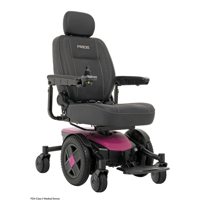 A black and pink Pride Mobility Jazzy® EVO 613 Powerchair with ATX Suspension features a padded seat, headrest, armrests, joystick control, footrest, four wheels, and Mid-Wheel 6® Technology. Pride is displayed on the backrest.