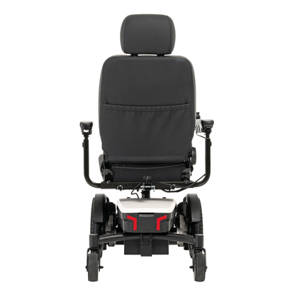 A rear view of the black and white Pride Mobility Jazzy® EVO 613 Powerchair with ATX Suspension, featuring a large backrest, headrest, armrests, and wheels with Mid-Wheel 6® Technology, shown on a plain white background.