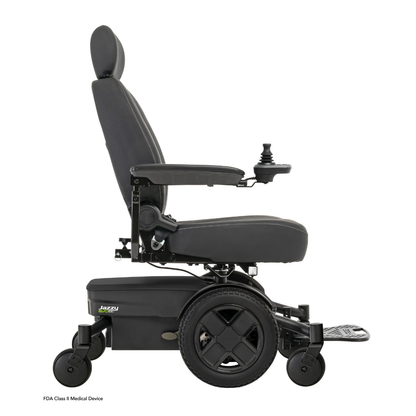 A black Pride Mobility Jazzy® EVO 613 Powerchair with ATX Suspension, cushioned seat, armrests, joystick controller, footrest, and four wheels with Mid-Wheel 6® Technology is shown in side profile on a white background.