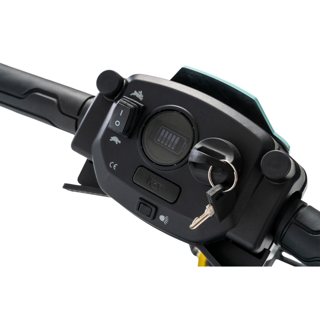 Close-up of the Pride Mobility Go Go® Super Portable Mobility Scooter handlebar panel, featuring a digital display with an airline-approved battery symbol, ignition key, headlight switch, and horn button. The plain white background enhances the lightweight scooters design.