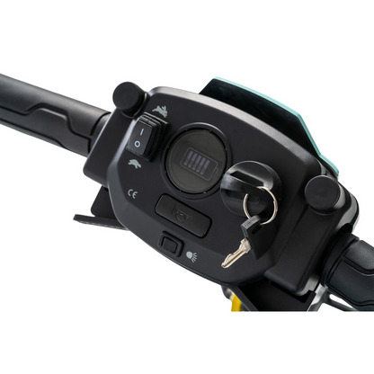 Close-up of the Pride Mobility Go Go® Super Portable Mobility Scooter handlebar panel, featuring a digital display with an airline-approved battery symbol, ignition key, headlight switch, and horn button. The plain white background enhances the lightweight scooters design.