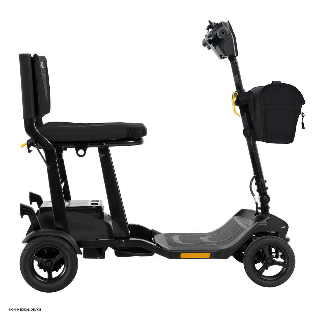 The Pride Mobility Go Go® Super Portable Mobility Scooter features a black seat, armrests, backrest, sturdy floorboard and handlebars. It includes a small bag on the tiller, has four wheels, and comes with an airline-approved battery for convenient personal transportation.