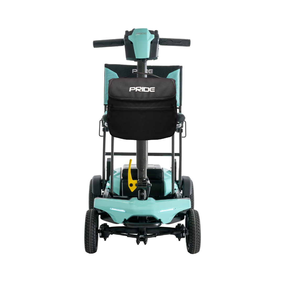 The rear view of the Pride Mobility Go Go® Super Portable Mobility Scooter showcases its teal color with black accents. This lightweight, four-wheeled scooter has a compact design, an airline-approved battery, and visible handlebars at the top.