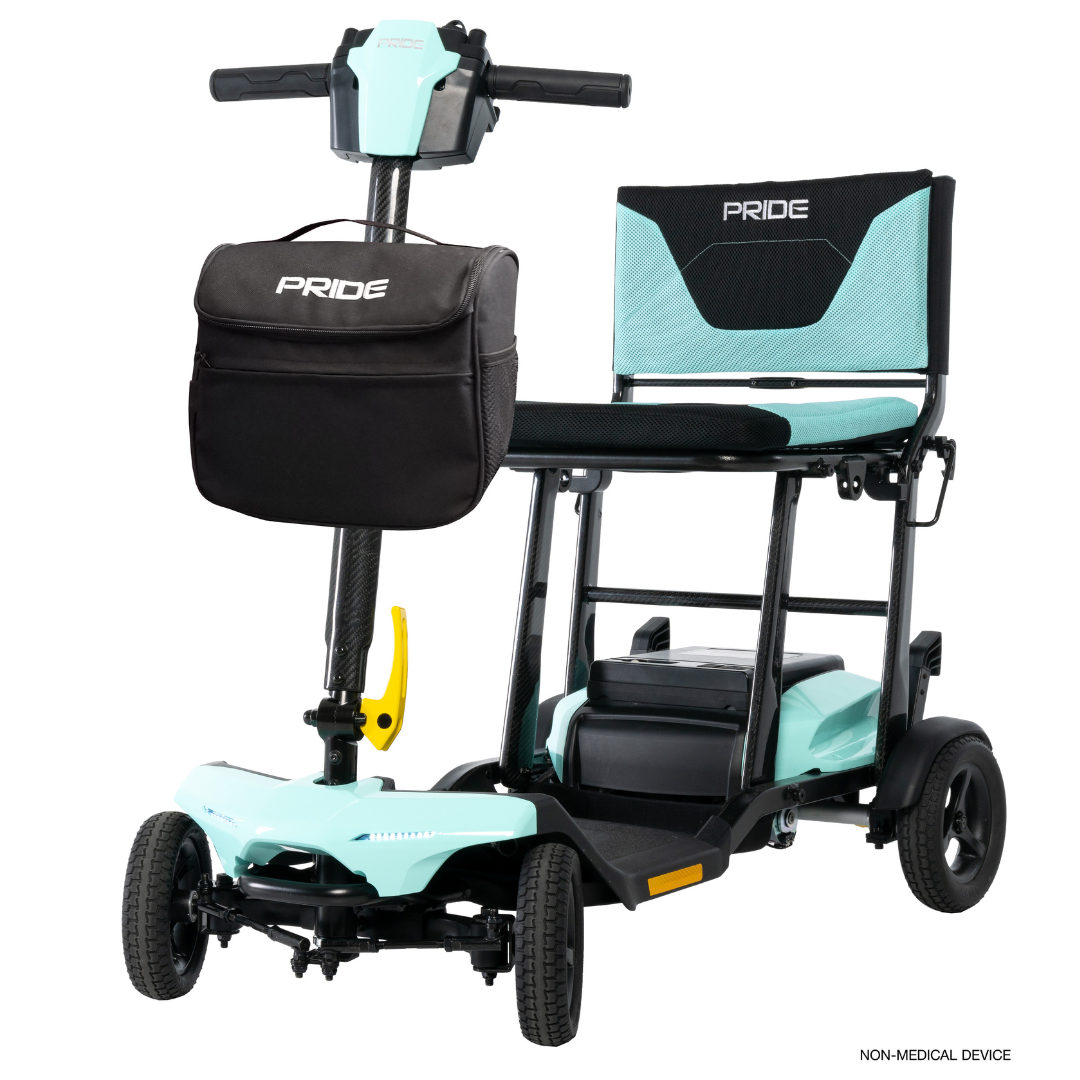 The Pride Mobility Go Go® Super Portable Mobility Scooter features a light blue frame, black seat and backrest, detachable black front bag, and four small wheels. Its lightweight and non-medical, perfect for everyday use.