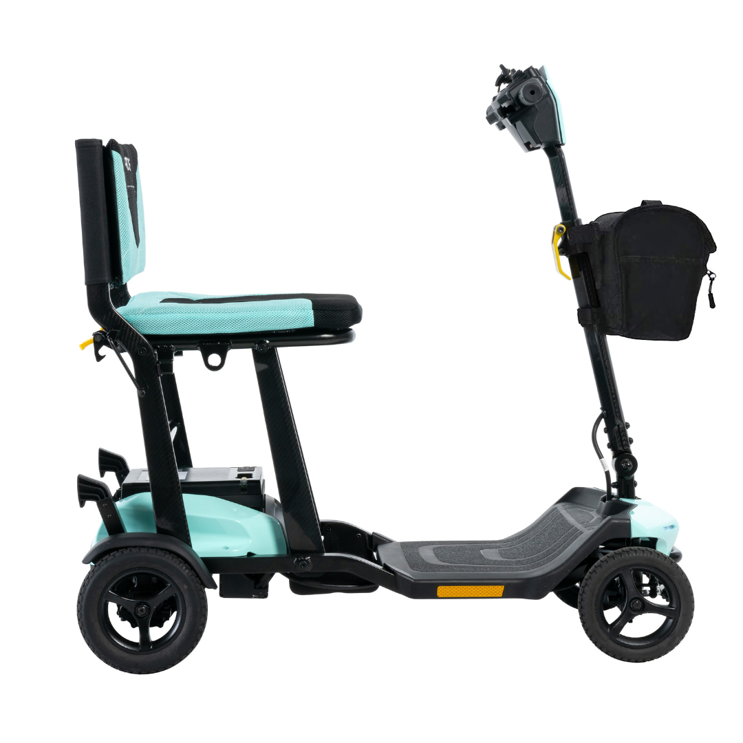 The Pride Mobility Go Go® Super Portable Mobility Scooter in teal and black features a seat, handlebars, a small storage bag, three wheels, and a footrest. Its compact design is sturdy for indoor and outdoor use, with a lightweight build that includes an airline-approved battery.