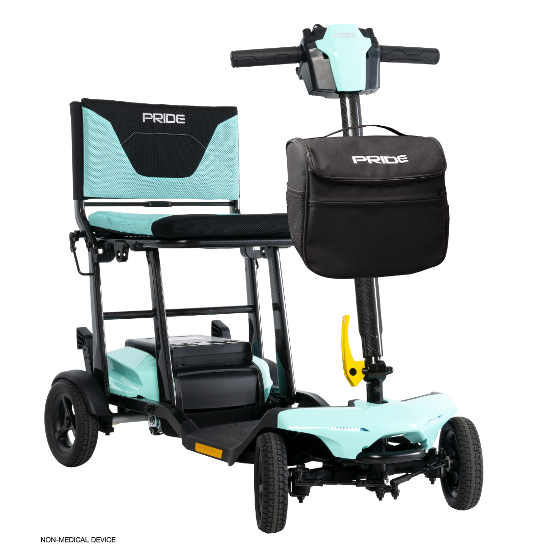 The Pride Mobility Go Go® Super Portable Mobility Scooter, in teal and black, features four wheels, a padded seat and backrest with branding, handlebars, and a front black storage bag. This lightweight scooter includes an airline-approved battery for easy travel.