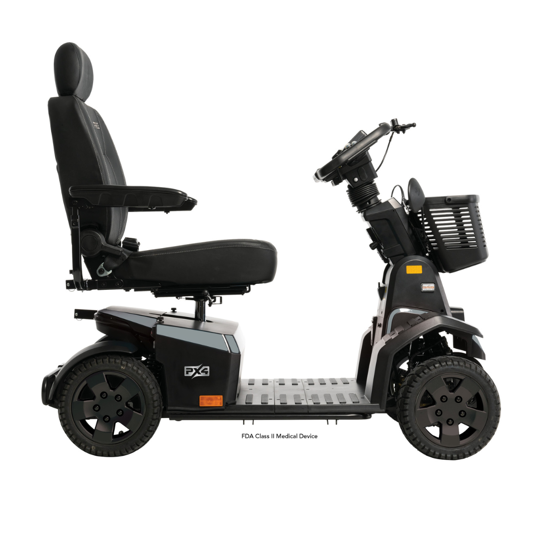 The Pride Mobility PX4 HD Bariatric Scooter, shown from the side on a white background, features a padded seat with armrests and headrest, large wheels, front basket, control panel, and supports up to 500 lbs.