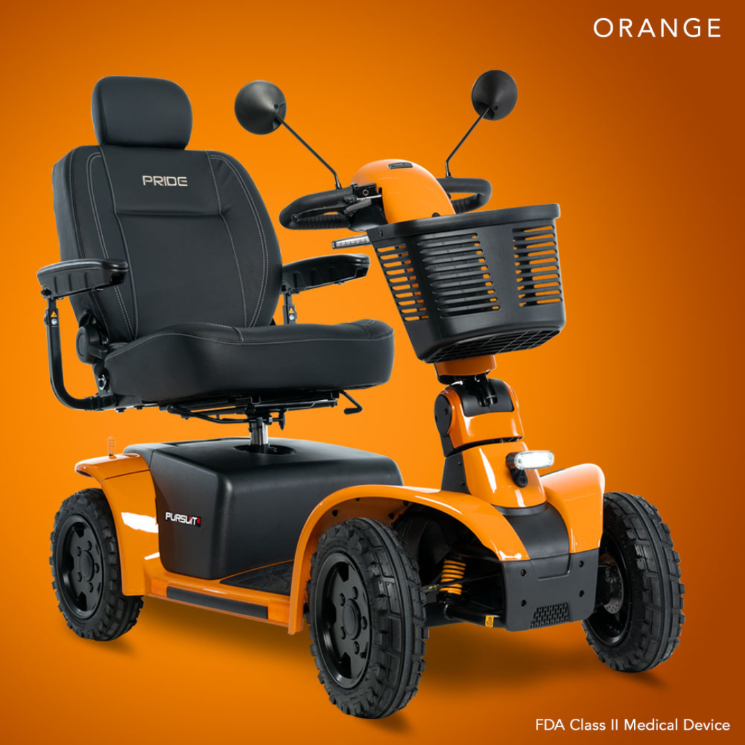 The Pride Mobility Pursuit® 2 Offroad HD Scooter, a bright orange model with a black seat, armrests, front basket, and rugged tires, is shown on an orange background labeled “ORANGE.” This durable scooter is an FDA Class II Medical Device.