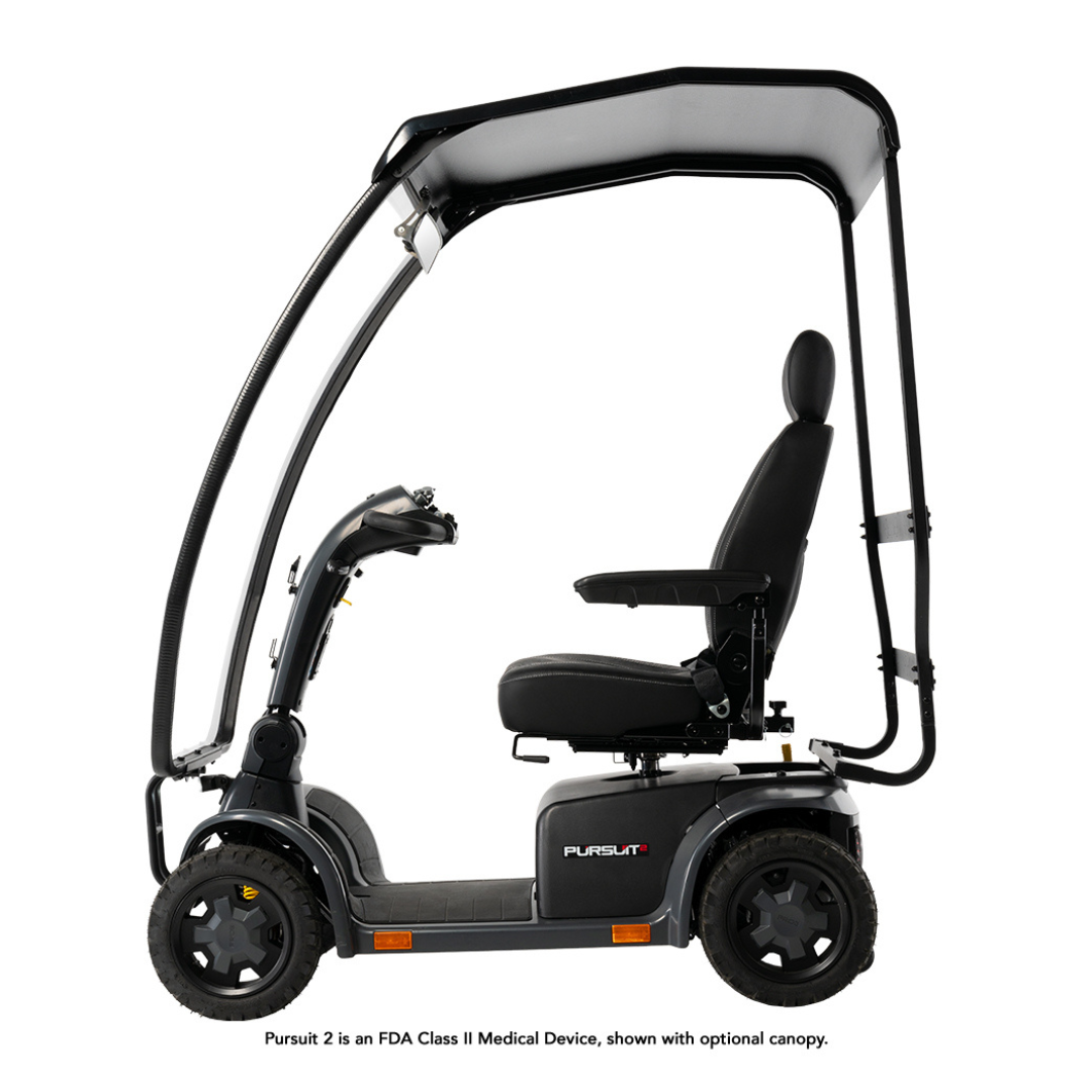 The Pride Mobility Pursuit® 2 Offroad HD Scooter is a black outdoor model with a roof canopy, padded seat, armrests, and four wheels. Shown in profile on a white background, this lightweight scooter provides durability, comfort, and protection for daily use.