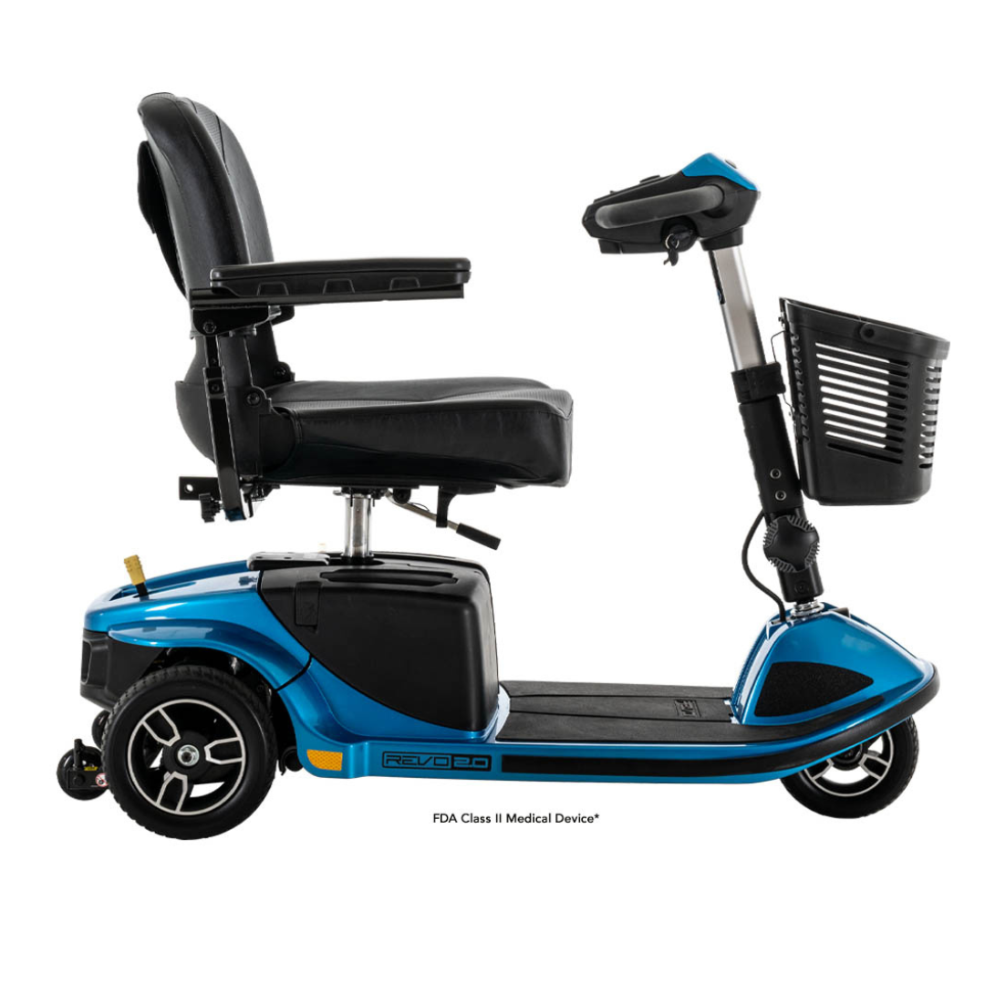 The Pride Mobility Revo® 2.0 3-Wheel Scooter is blue with comfort suspension, a high-backed seat, armrests, handlebars, and a front basket, shown from the side on a white background.