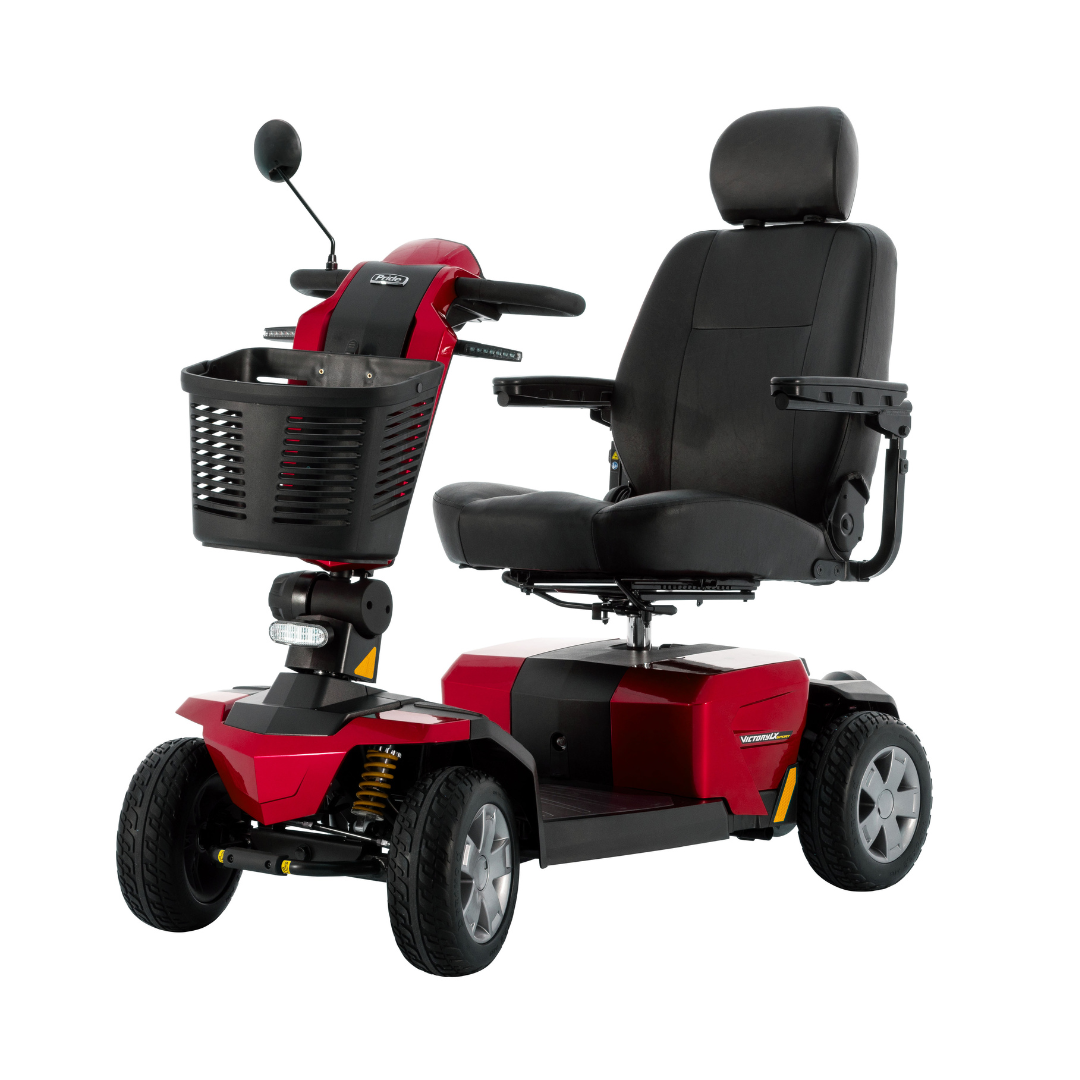 The Pride Mobility Victory LX Sport Scooter is a rugged red and black mobility scooter with Comfort-Trac Suspension, padded seat, armrests, headrest, front basket, mirrors, and four wheels—ideal for people with limited mobility.