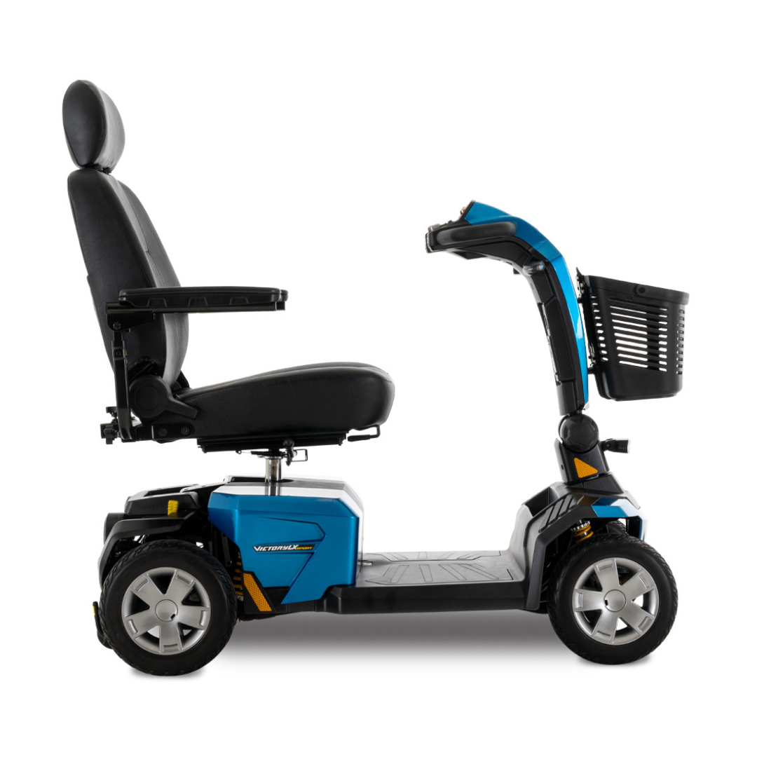 A Pride Mobility Victory LX Sport Scooter in blue, featuring a cushioned seat, armrests, backrest, and a black front basket—shown in profile on a white background—perfect for those seeking a rugged mobility scooter.