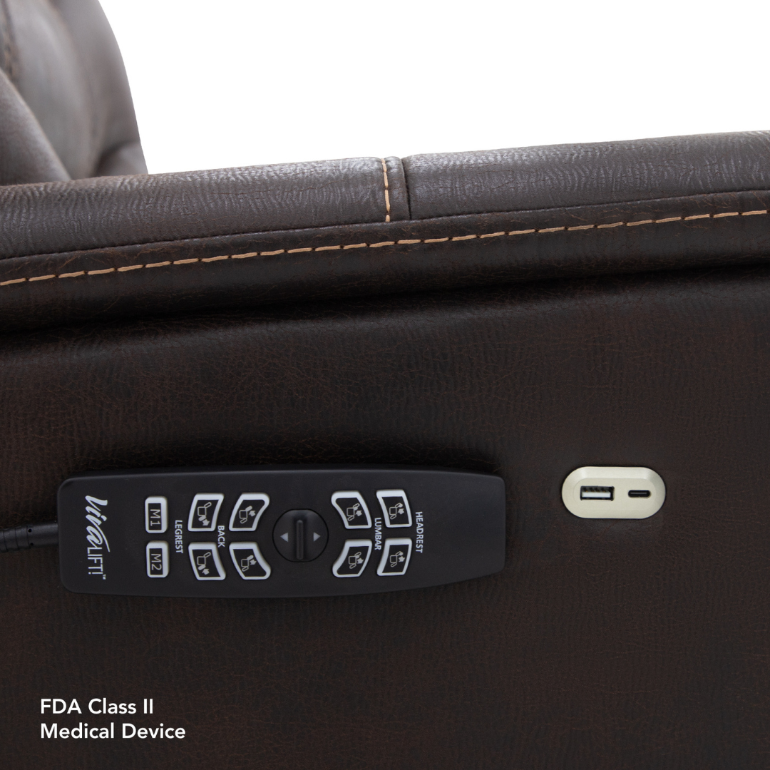 A close-up of a brown leather Pride VivaLift!® Elegance 2 Recliner with Lift Assist armrest features a VitaLift remote, USB charging port, and visible stitching. Text: FDA Class II Medical Device—designed for luxurious relaxation.