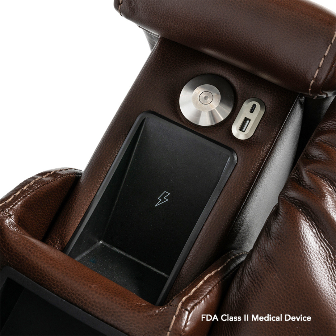 Close-up of a brown leather Pride VivaLift! Premier Recliner With Assisted Lift, Audio & Massage armrest, showing built-in control panel with metallic dial, USB port, wireless charging pad. FDA Class II Medical Device. Model: PLR-5900.