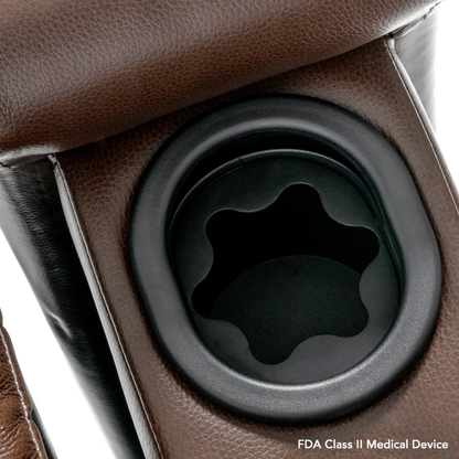 Close-up of a brown leather armrest with built-in black cup holder on the Pride VivaLift! Premier Recliner With Assisted Lift, Audio & Massage. "FDA Class II Medical Device" is noted in the lower right corner.
