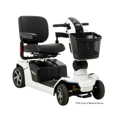 The Pride Mobility Zero Turn 10 HD Scooter is a white, four-wheel midsize scooter with a black cushioned seat, armrests, backrest, front control panel, and front storage basket. It is an FDA Class II Medical Device for added safety.