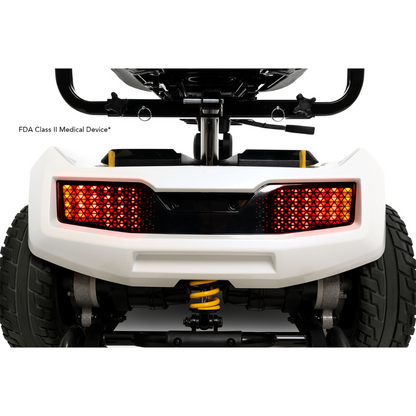 Rear view of the Pride Mobility Zero Turn 10 HD Scooter displaying illuminated red tail lights, large tires, a white bumper, and visible suspension components.