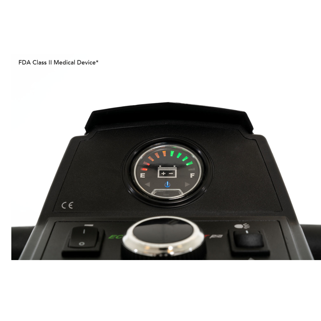 Close-up of the control panel on the Pride Mobility Zero Turn 10 HD Scooter shows a full battery gauge. FDA Class II Medical Device* is displayed on the left. Buttons and a dial below highlight EZ Turn Technology.