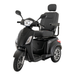 The Pride Baja® Raptor® 2 Bariatric 3-Wheel Scooter is a black mobility scooter with advanced shock absorption, cushioned seat, backrest, armrests, side mirrors, front and rear lights, and alloy wheels for comfortable outdoor travel.