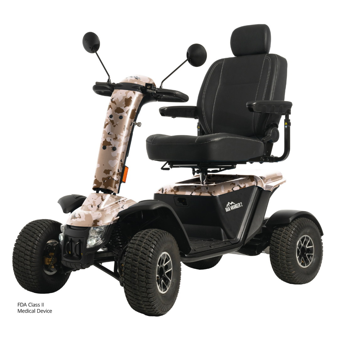The Pride Baja® Wrangler® 2 Heavy Duty Outdoor Scooter has rugged tires, a camo-patterned body, black cushioned seat with armrests and headrest, rearview mirrors, advanced safety features, and displays the FDA Class II Medical Device label.