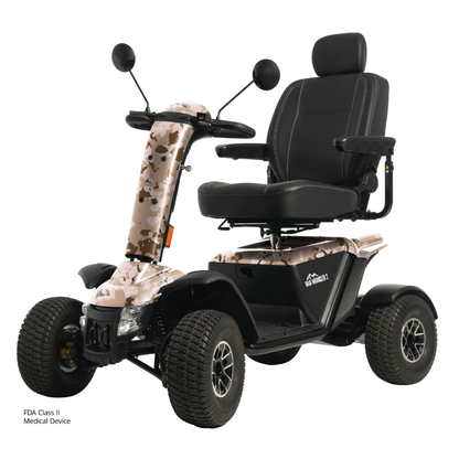 The Pride Baja® Wrangler® 2 Heavy Duty Outdoor Scooter has rugged tires, a camo-patterned body, black cushioned seat with armrests and headrest, rearview mirrors, advanced safety features, and displays the FDA Class II Medical Device label.