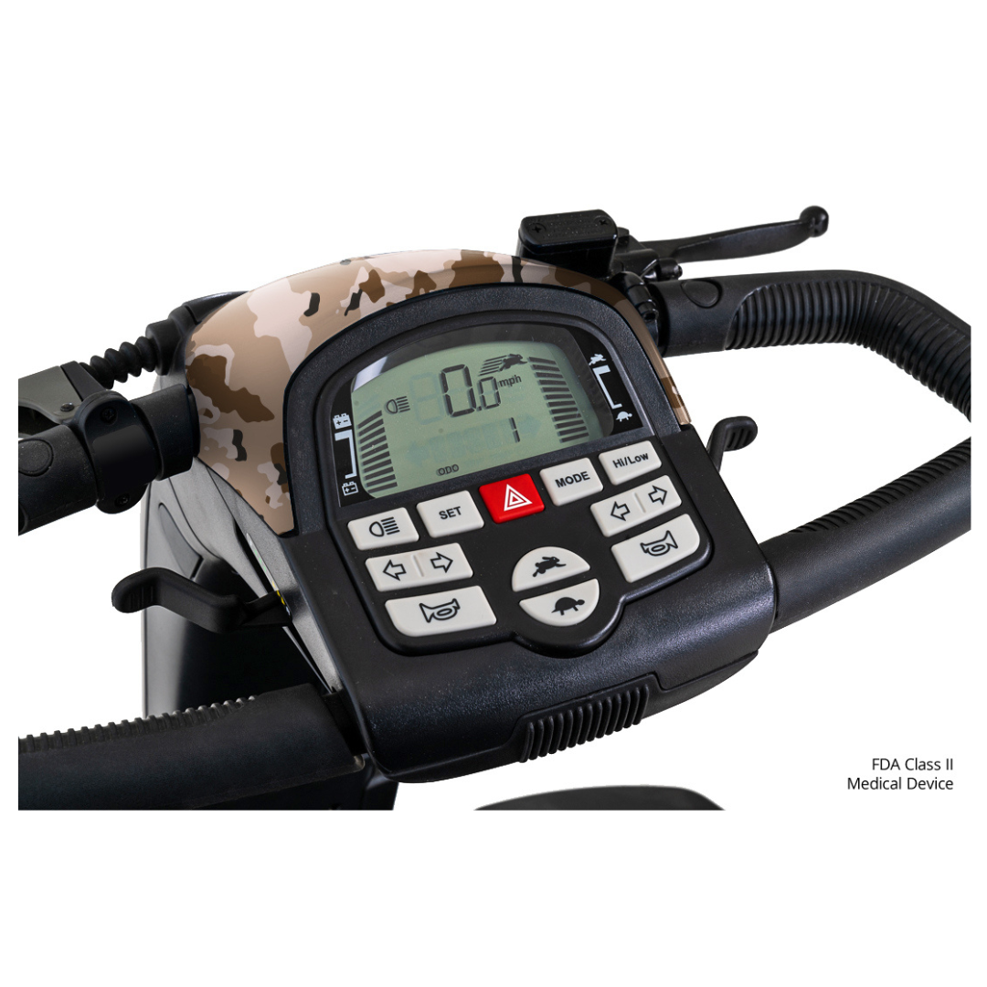 Close-up view of a Pride Baja® Wrangler® 2 Heavy Duty Outdoor Scooter control panel with camouflage design, digital speed display, settings buttons, and control icons. “FDA Class II Medical Device” text appears in the corner.
