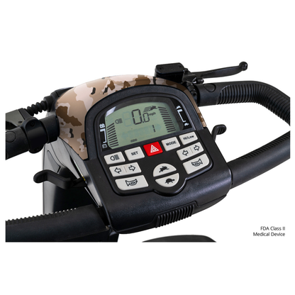 Close-up view of a Pride Baja® Wrangler® 2 Heavy Duty Outdoor Scooter control panel with camouflage design, digital speed display, settings buttons, and control icons. “FDA Class II Medical Device” text appears in the corner.