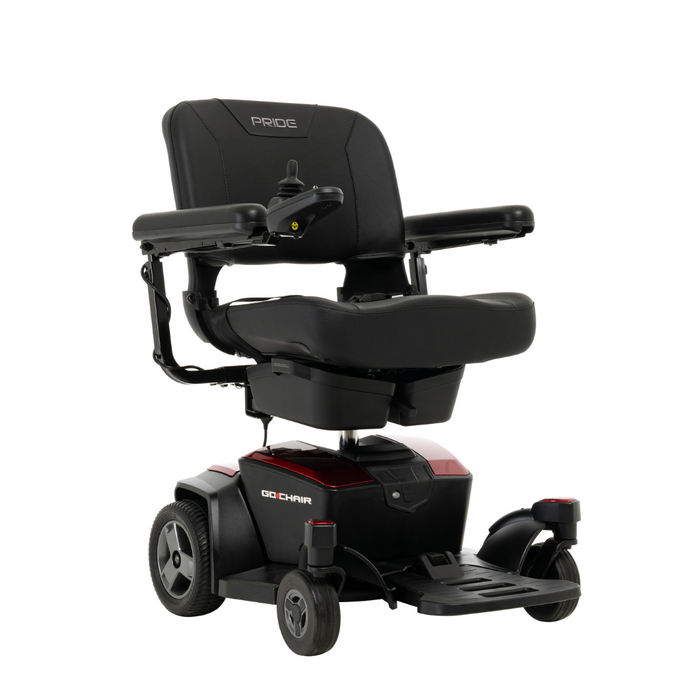 A black Pride Mobility Go Chair® Portable Powerchair with padded seat, armrests, joystick control, and four wheels provides enhanced agility and dependable mobility assistance. The model name is visible on the side.