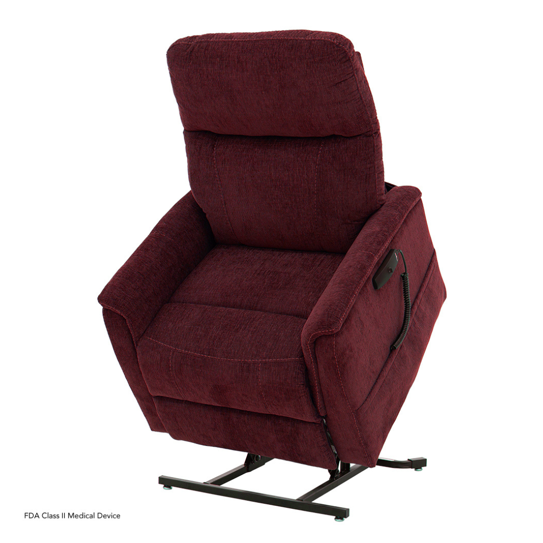 The Pride Mobility Genesis LC150 Lift Chair Recliner in maroon features padded armrests, a cushioned backrest, a lift mechanism, and an attached remote control. Detailed specs are available in the specification table.