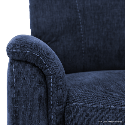 Close-up of the Pride Mobility Genesis LC150 Lift Chair Recliner, showcasing its blue textured fabric, curved armrest, and visible stitching against a white background. See the specifications table for full details.