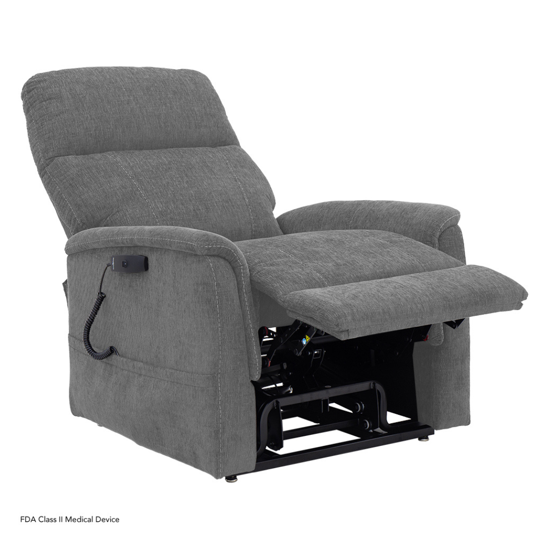 The Pride Mobility Genesis LC150 Lift Chair Recliner is a gray fabric recliner with an extended footrest and wired remote, ideal for comfort and medical needs. See the product description or spec table for full details. Shown on a white background.