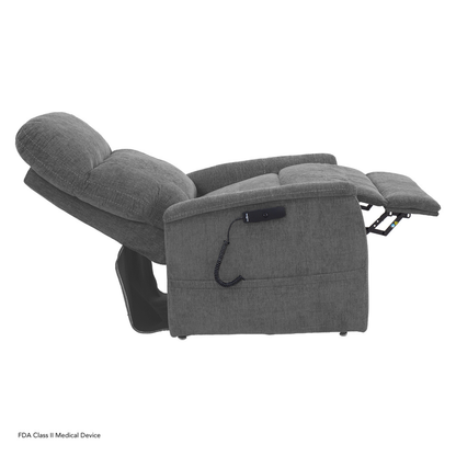 The Pride Mobility Genesis LC150 Lift Chair Recliner is shown fully reclined in gray upholstery, featuring a corded remote control on the side. Check the spec table in the description for full product details.