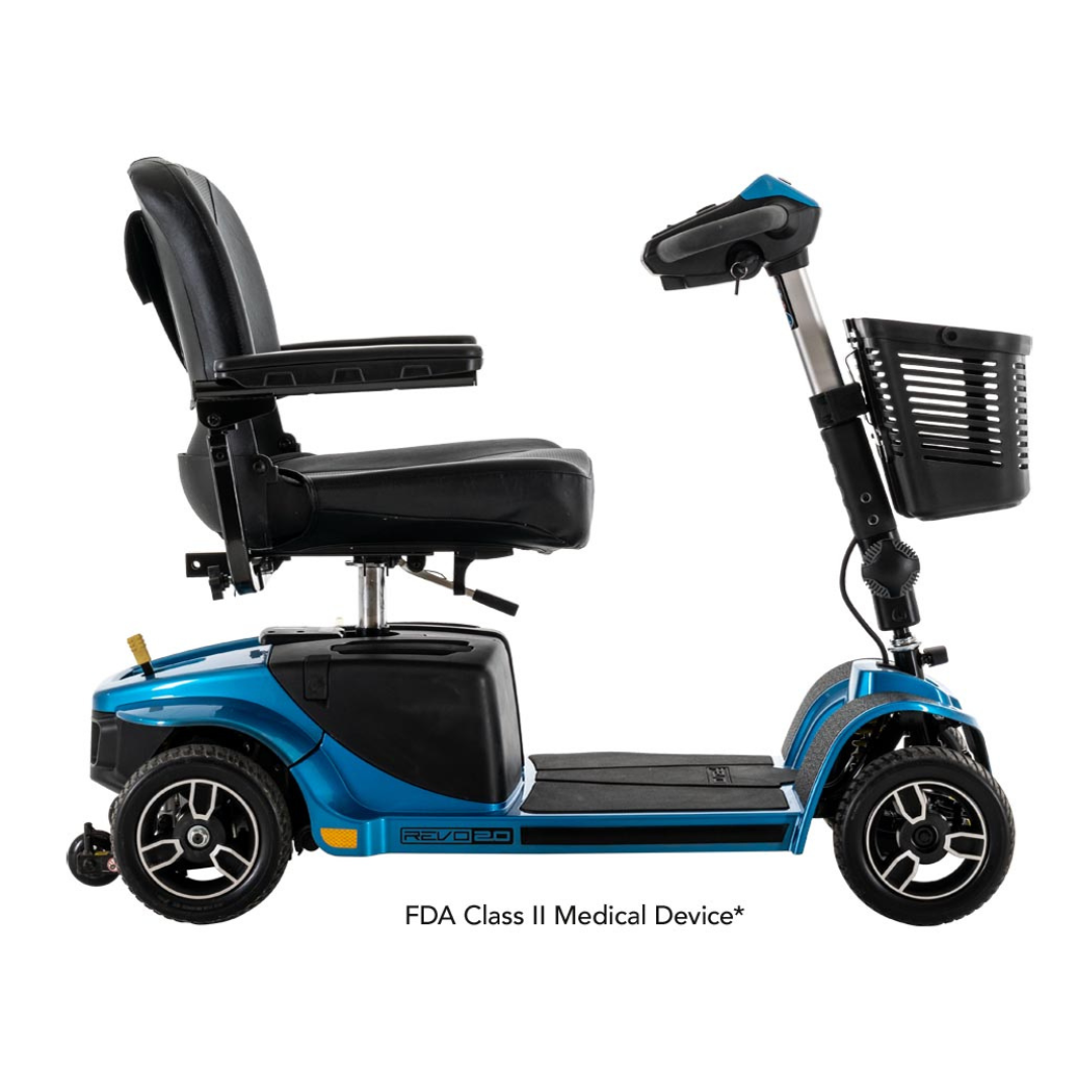 The Pride Mobility Revo® 2.0 4-Wheel Scooter, shown from the side on a white background, features a blue finish, black cushioned seat with armrests, front basket, four wheels, and is labeled as an FDA Class II Medical Device.