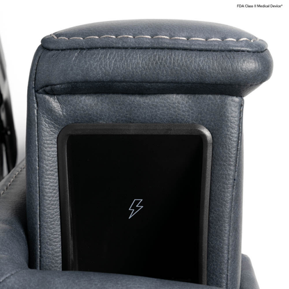 Close-up of a dark blue leather armrest with visible stitching and a built-in black wireless charging pad—an elegant feature found on the Pride VivaLift Ultra PLR4955 Recliner with Lift Assist, Heat, and Massage.