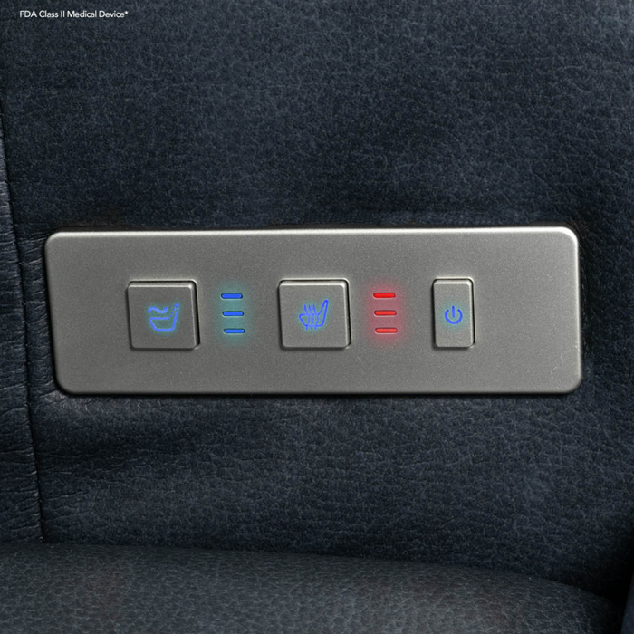Close-up of a control panel on the Pride VivaLift Ultra PLR4955 Recliner with Lift Assist, Heat, and Massage—four buttons for reclining, seat adjust, heat (red), and power, outlined by blue/red LEDs. Ideal for advanced comfort and ease.
