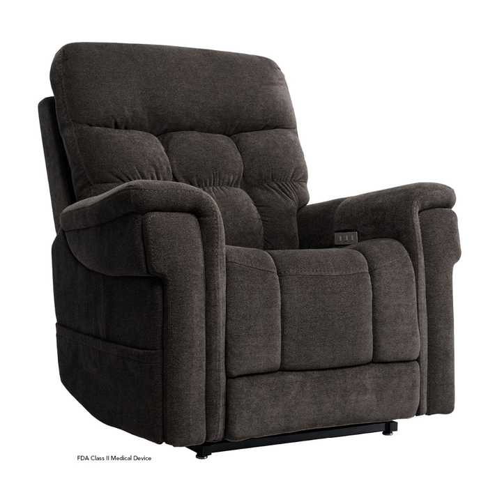 The Pride VivaLift Ultra PLR4955 Recliner with Lift Assist, Heat, and Massage features dark gray upholstery, a tufted backrest, thick cushioned arms, side control panel, and True-Infinite Positioning. Chair shown at an angle for detail.