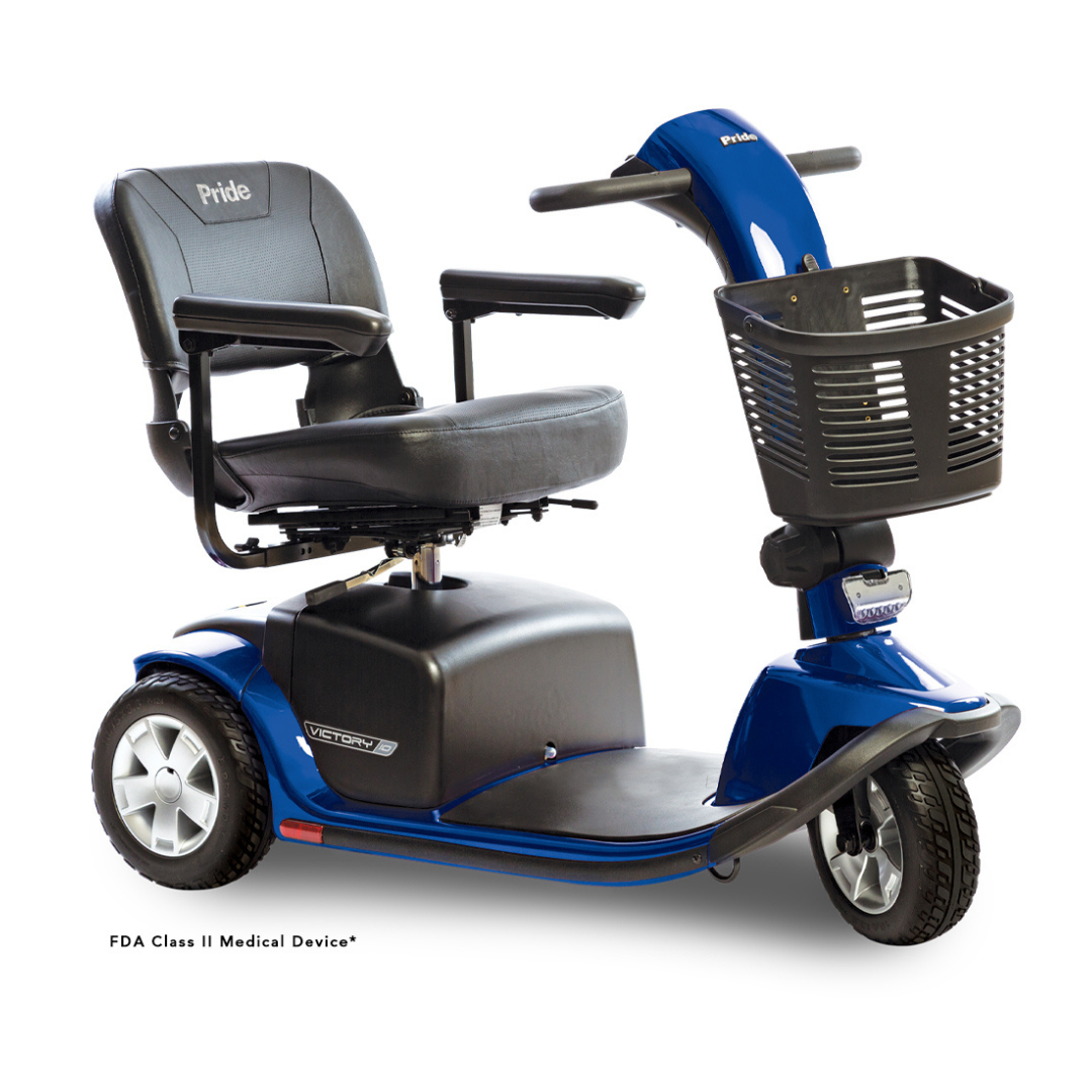 The Pride Mobility Victory® 10 Bariatric 3-Wheel Scooter is a blue mobility scooter featuring three wheels, a front basket, a black padded seat with armrests, and the Pride logo on the seat. Designed for personal transportation and medical use, this luxury scooter combines style and comfort to enhance your independence.