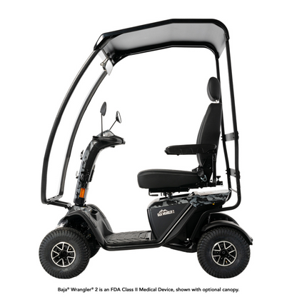 The Pride Baja® Wrangler® 2 Heavy Duty Outdoor Scooter with Canopy is a four-wheel black mobility scooter with a seat, armrests, and raised canopy. It’s an FDA Class II medical device; canopy shown is optional.