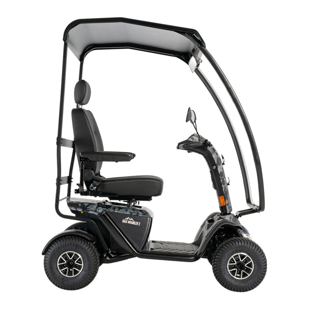 The Pride Baja® Wrangler® 2 Heavy Duty Outdoor Scooter with Canopy is a black, four-wheel mobility scooter featuring a cushioned seat with armrests and headrest, handlebar control panel, advanced safety features, and overhead canopy.