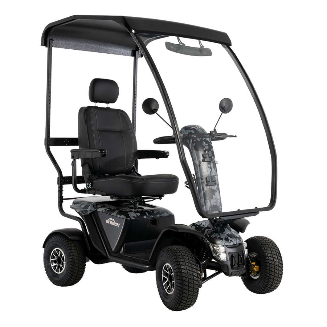 The Pride Baja® Wrangler® 2 Heavy Duty Outdoor Scooter with Canopy features a black seat, armrests, headrest, roof, clear windshield, side mirrors, and rugged tires—built for outdoor performance and comfort on any adventure.