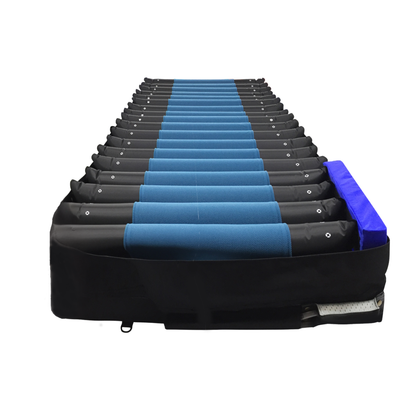 A Prius Rhythm Multi Plus Bariatric Pressure Redistribution Mattress, featuring alternating blue and black air cells and pictured from the foot end, is designed to provide enhanced pressure redistribution for superior pressure relief and patient comfort.