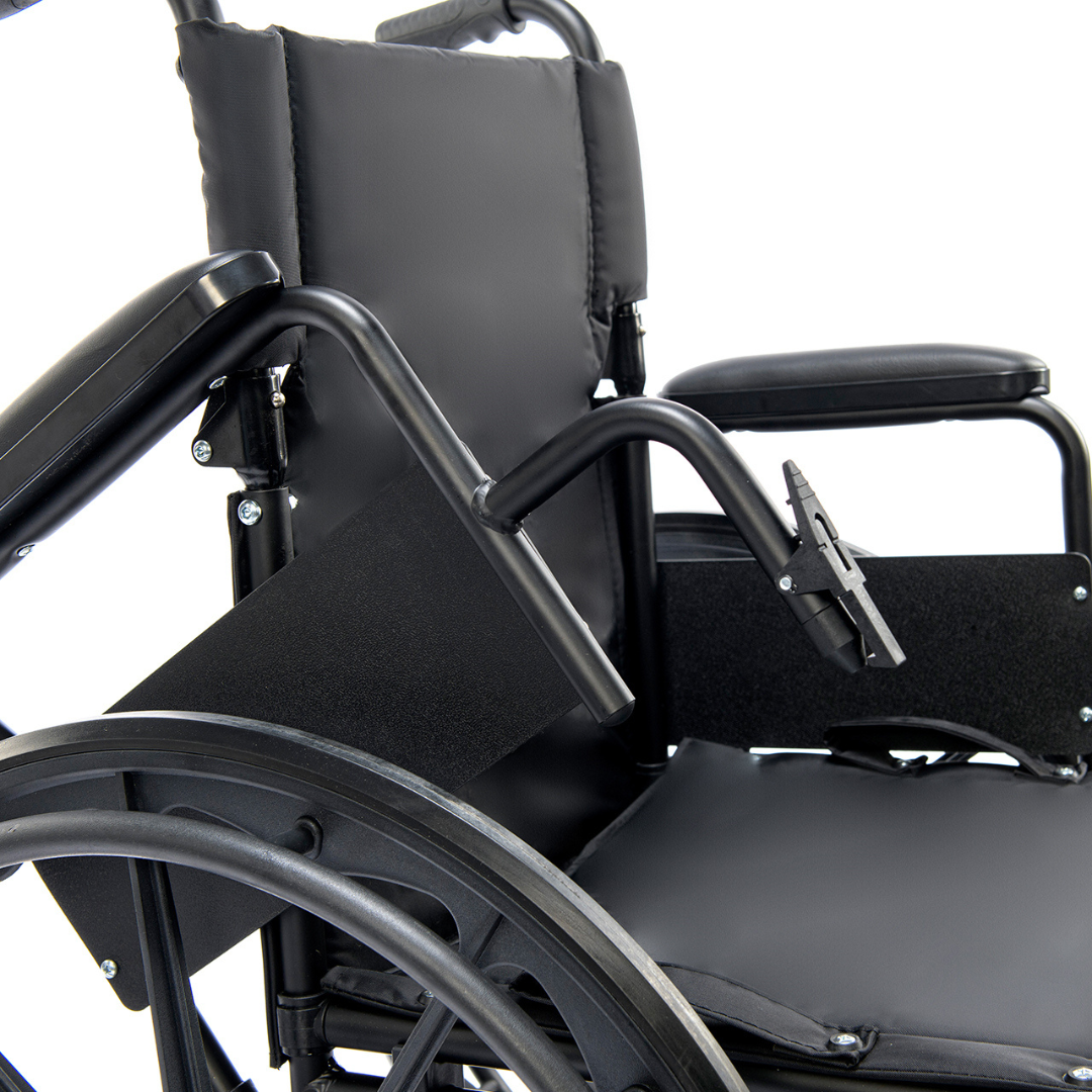 Close-up of the Protekt Cambria™ Transport/Wheelchair Combo, highlighting its high-strength, lightweight design and flip-back armrest, with part of the padded seat and wheel visible.