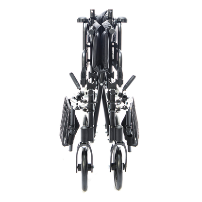 The Protekt Cambria™ Transport/Wheelchair Combo is a high-strength black double stroller that folds upright, with wheels and frame compactly aligned for storage or transport; seats and handlebars remain clearly visible.