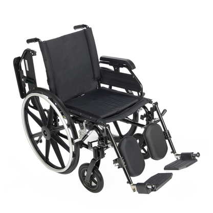 A Proactive Chariot IV XTC Wheelchair with Adjustable Seat Depth, featuring large rear wheels, small front wheels, adjustable footrests, padded leg supports, and a black frame, is displayed against a white background.