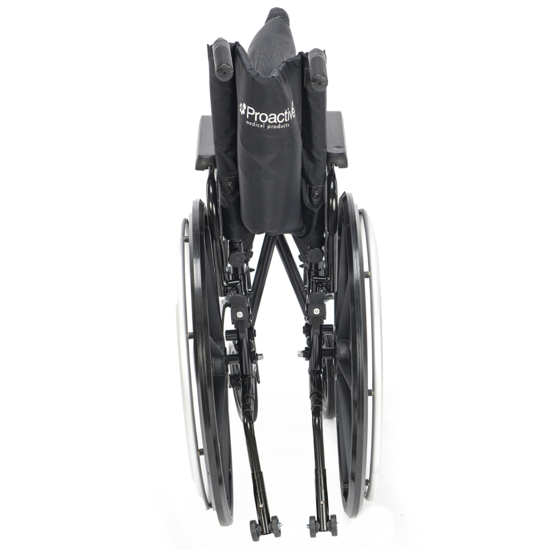 A folded Proactive Chariot IV XTC Wheelchair with Adjustable Seat Depth is shown from the rear, displaying its black design, branded backrest, large rear wheels, and footrests for convenient storage or transport.