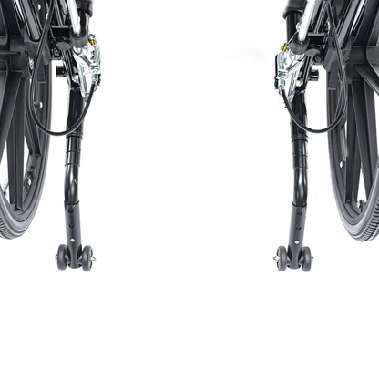 Close-up of the Proactive Chariot IV XTC-RC Pediatric Folding Reclining Wheelchair's lower rear, showing its black carbon steel frame, wheels, and small rear anti-tip wheels against a white background.