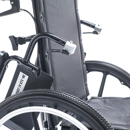 Close-up view of the Proactive Chariot IV XTC-RC Pediatric Folding Reclining Wheelchair, featuring its black carbon steel frame, armrests, backrest, rear wheel, and part of the seat against a white background.