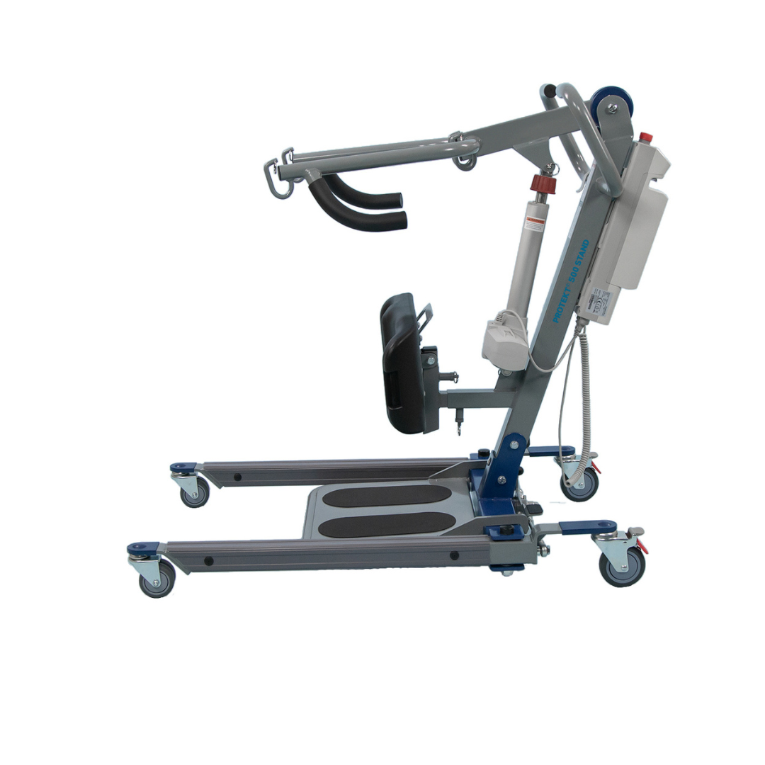 A side view of the Proactive Protekt® 500/600 lb Sit-to-Stand Lift in blue and silver, featuring wheels, handlebars, padded knee support, footrests, and an electric motor to assist safe transfers for those with limited mobility.