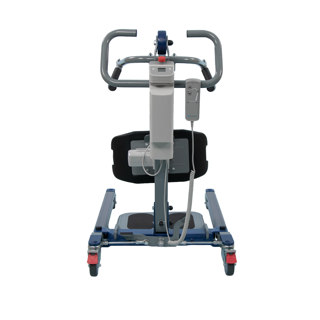 The Proactive Protekt® 500/600 lb Sit-to-Stand Lift features handlebars, padded knee support, a backrest, and wheeled base with a visible control unit and cables. It’s designed to assist with patient transfer or mobility support.